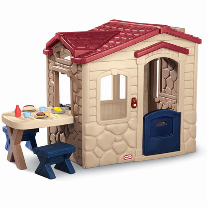 Playhouse has a built-in picnic table with complementary benches