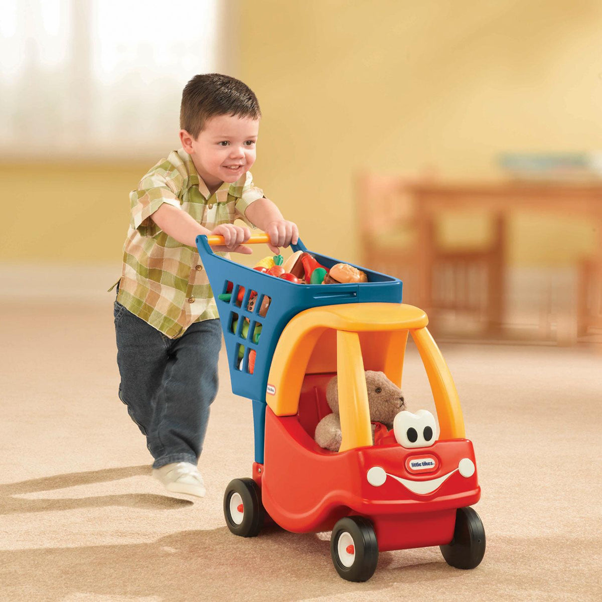 Boy playing with the shopping cart