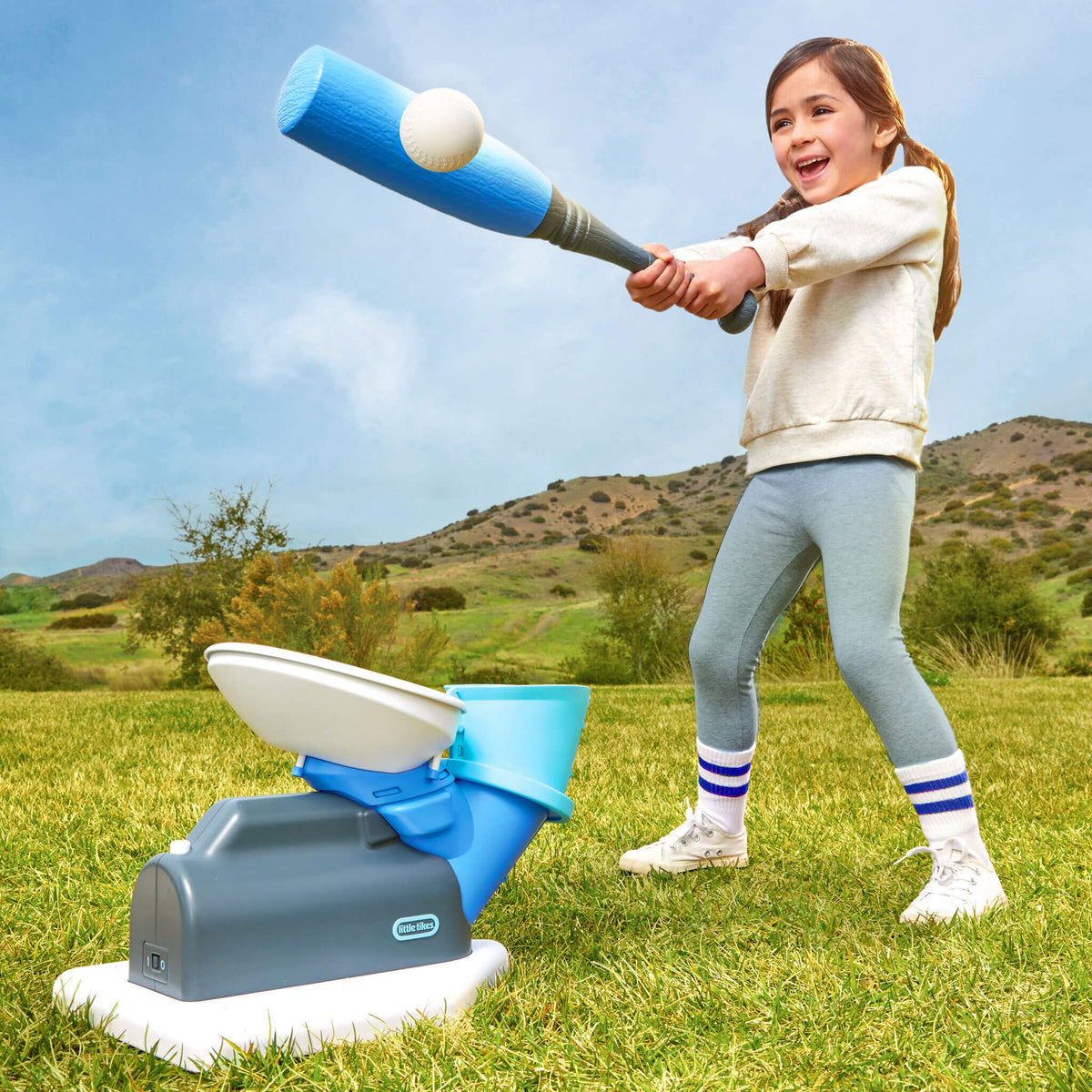 girl hitting a ball