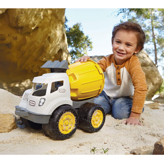Boy pushing Cement Mixer