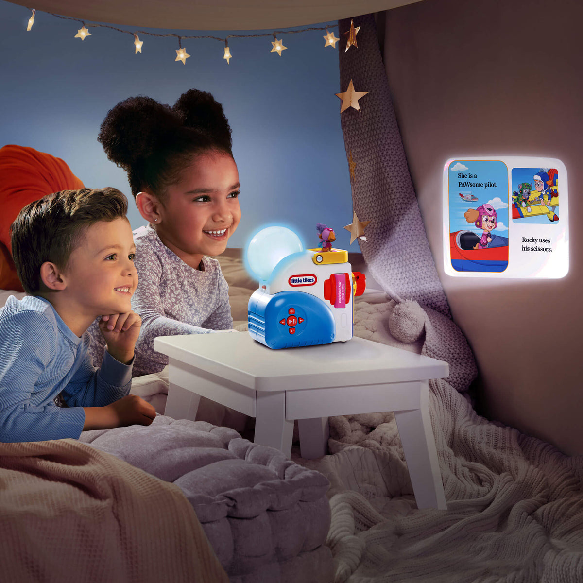 Children sitting in a cozy room with a Little Tikes toy and night light.